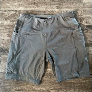 Dark green Avia athletic biker shorts with side pockets
